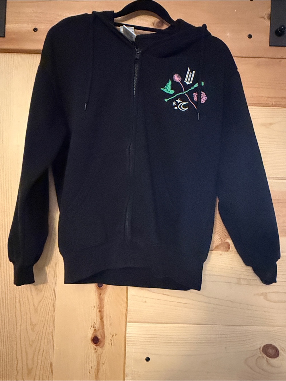 Black Zip-Up Hooded Sweatshirt with Subtle Floral Graphic